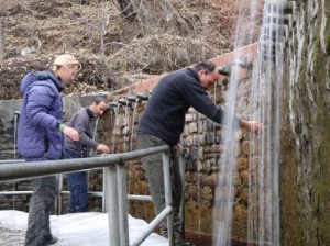 Emily_B, Steve_A and Kevin wash away their sins in the freezing holy water