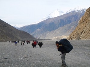 A busy day on the highway.  Purna (foreground) is one of our porters (aged 51, carrying Scott's, Kevin's and his own bag!)