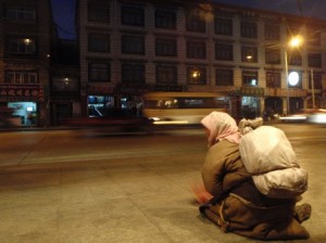 A beggar woman on the Lhasa street outside the restaurant.