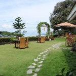 Tables for cocktails on the lawn, next to the croquet lawn.